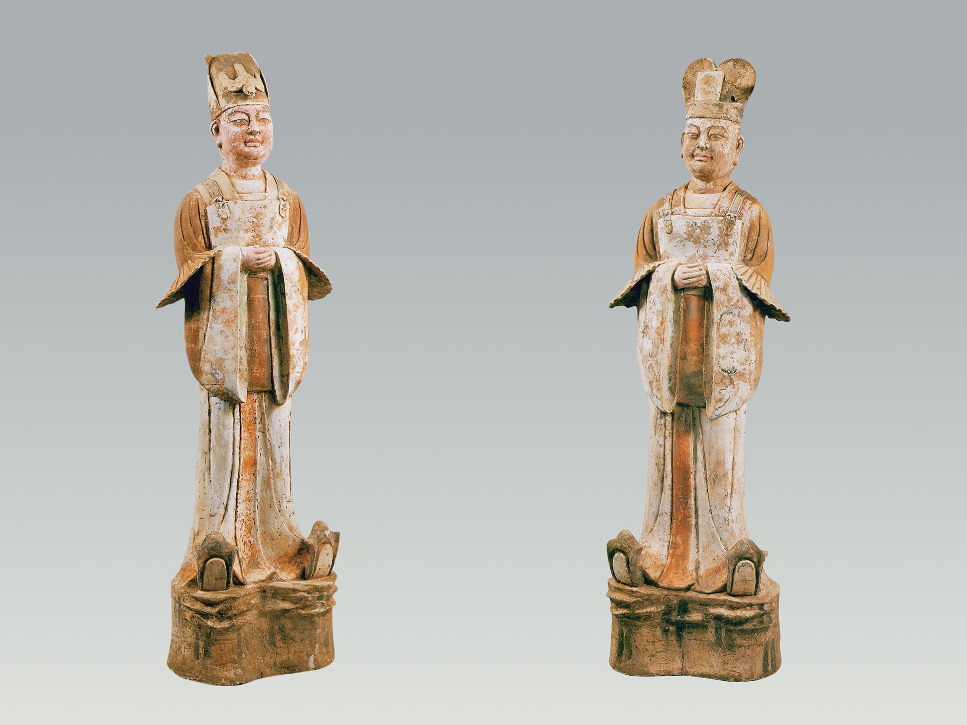 Pair of pottery civil officials with painted decoration