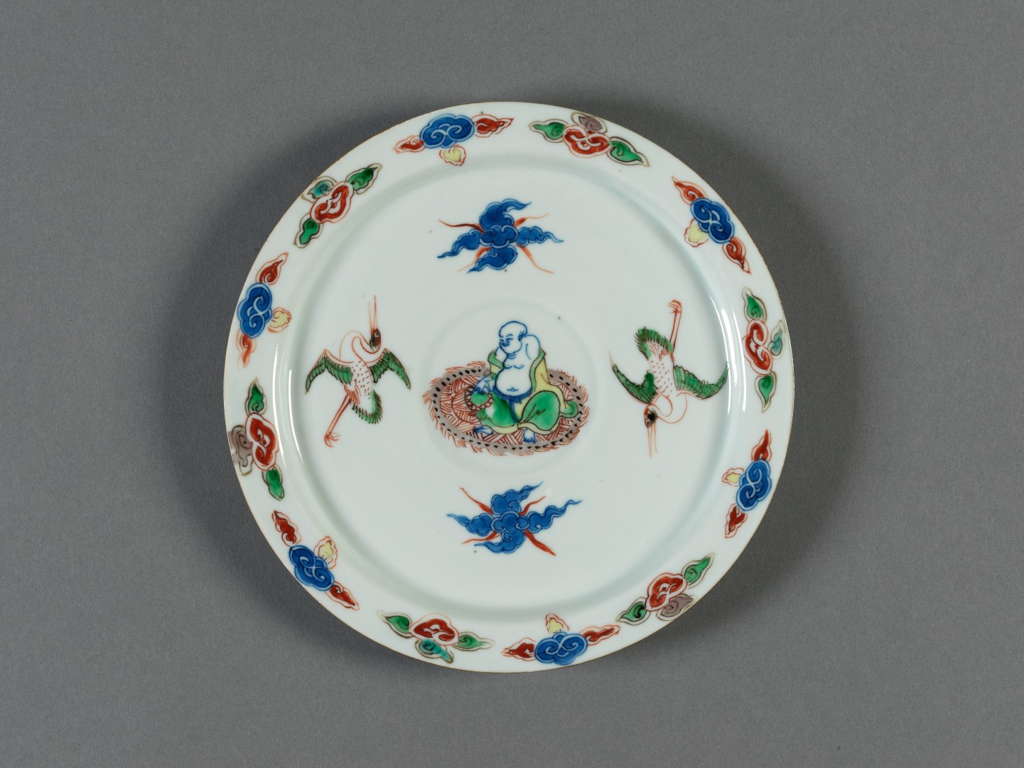 Dish with painted budai and cranes in wucai enamels